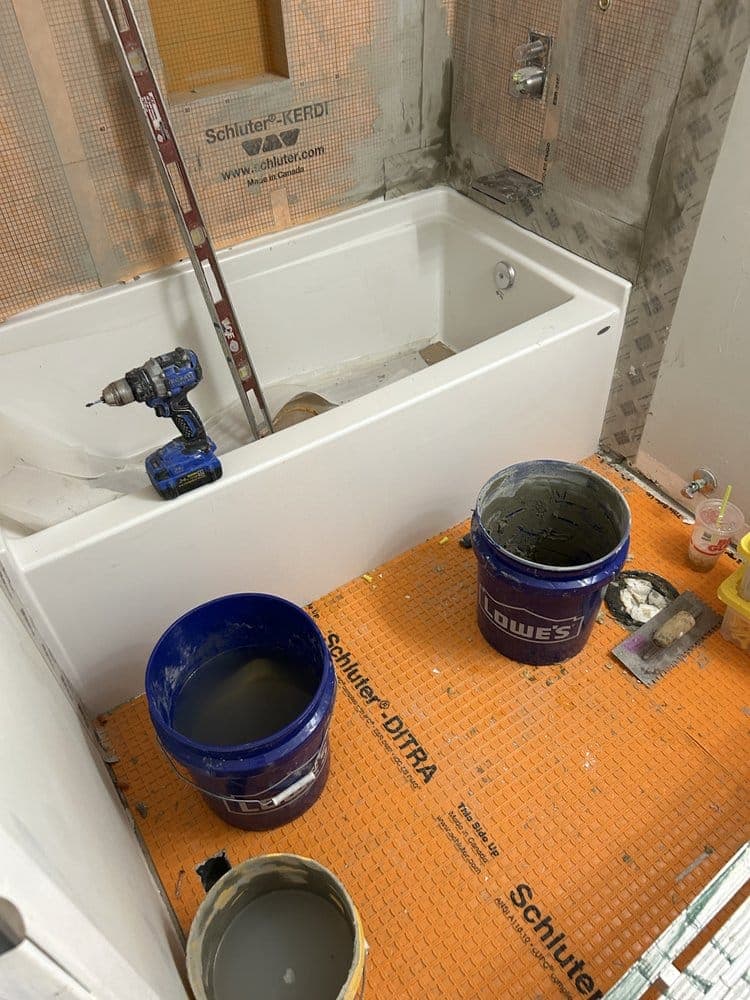 New tub set over waterproofing membrane