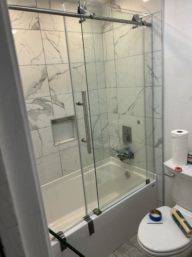 Tub and shower with sliding glass doors